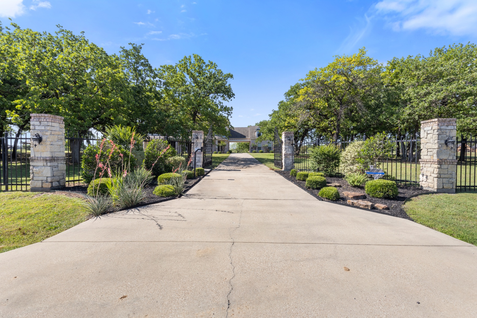 Gated stone-column driveway entry