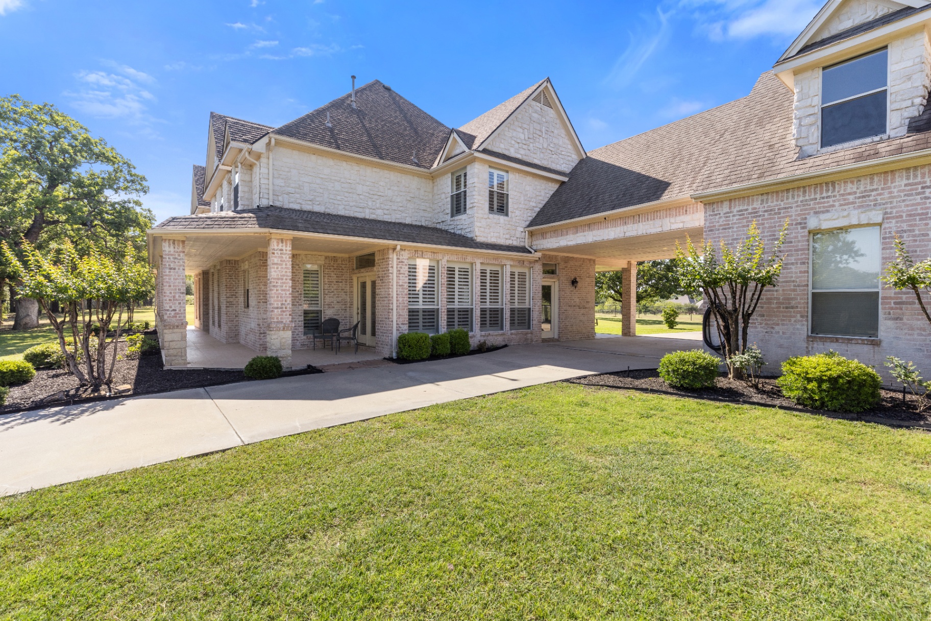Front with porte-cochere and covered porch