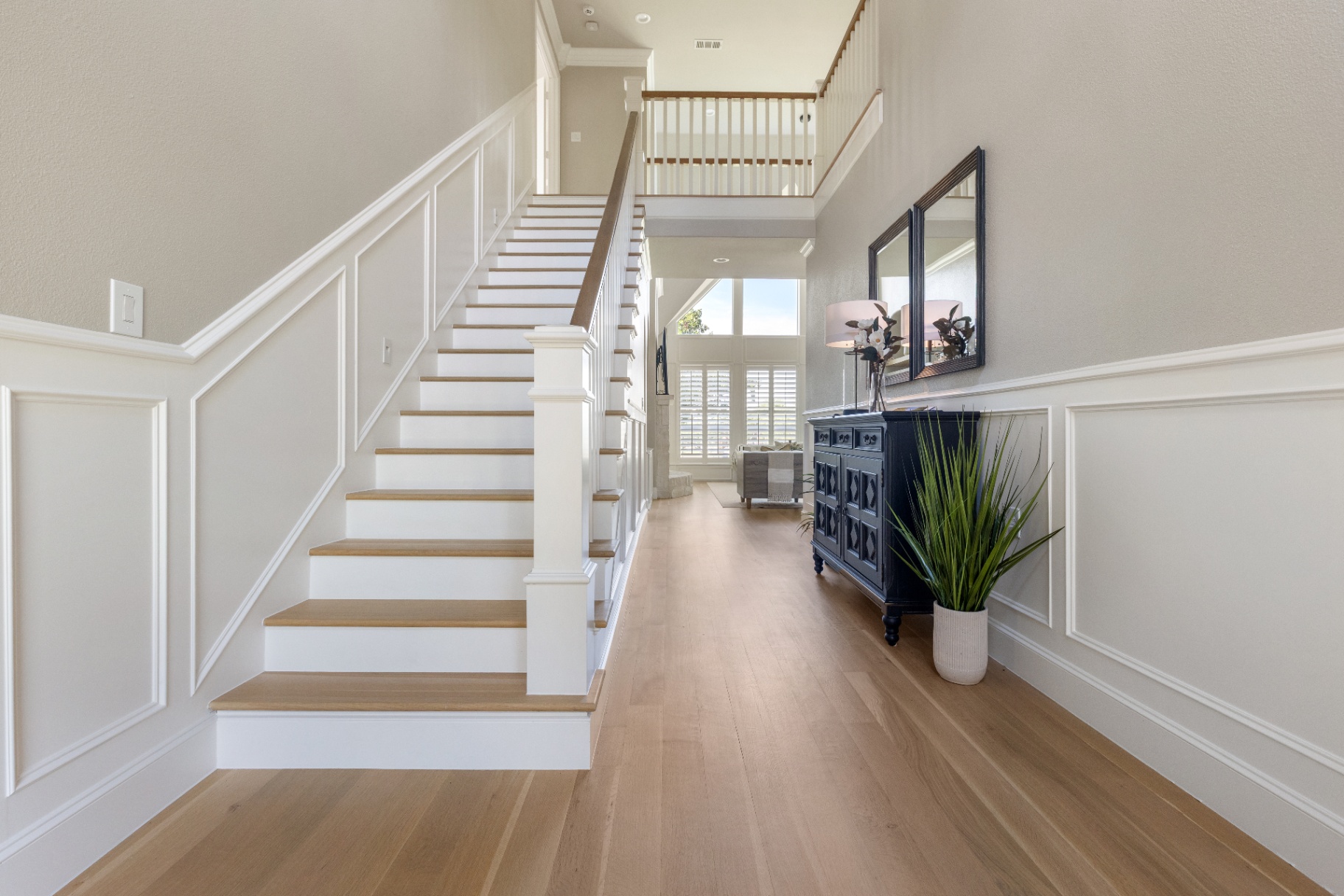 Two-story foyer with white oak staircase