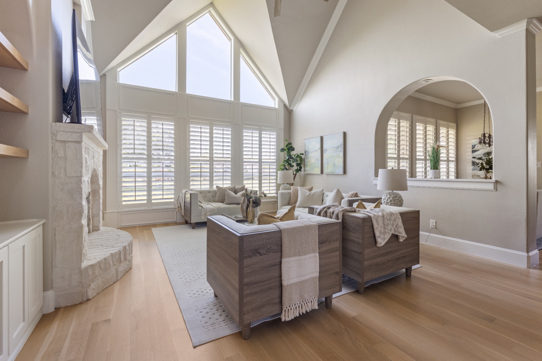 Vaulted living room with floor-to-ceiling windows