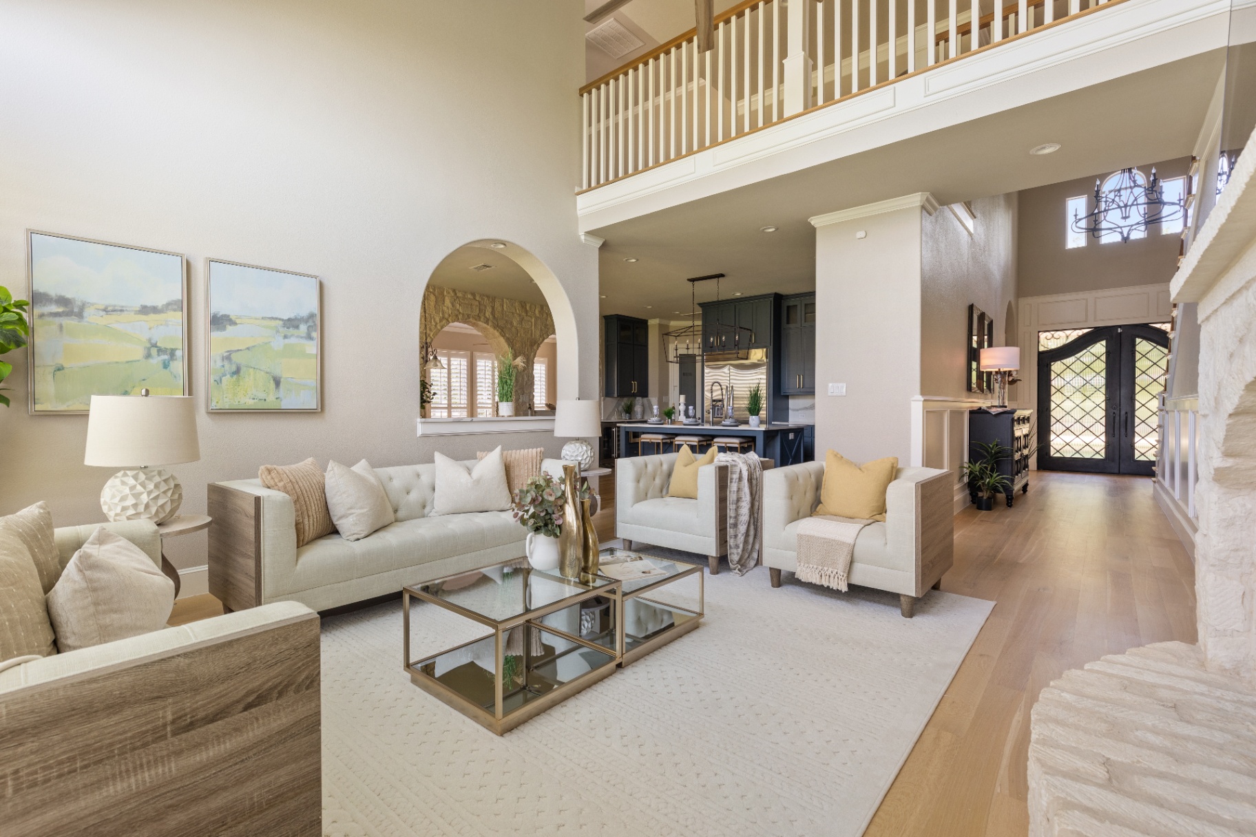 Two-story living room with stone fireplace