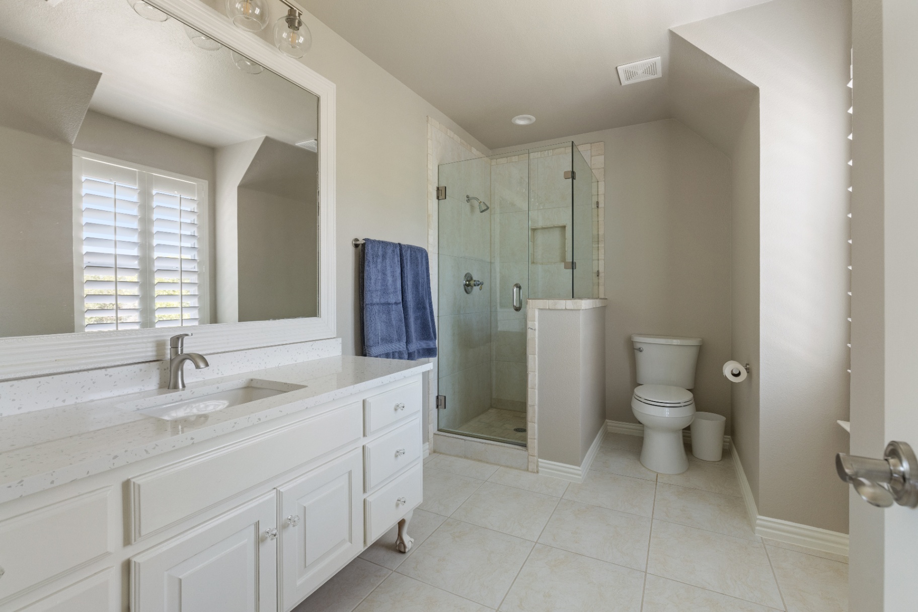Secondary bathroom with frameless glass shower