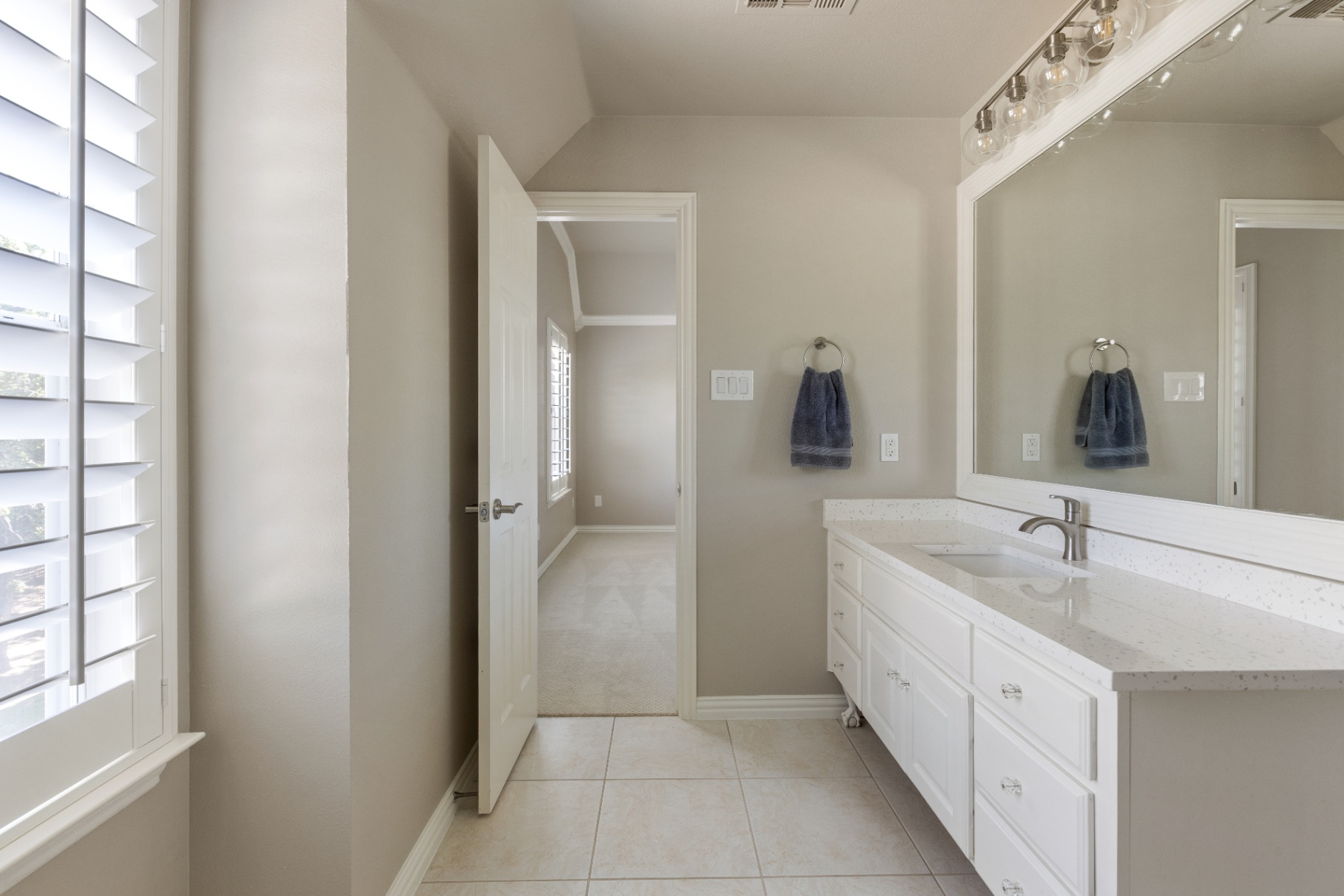 Upstairs bath with white cabinetry