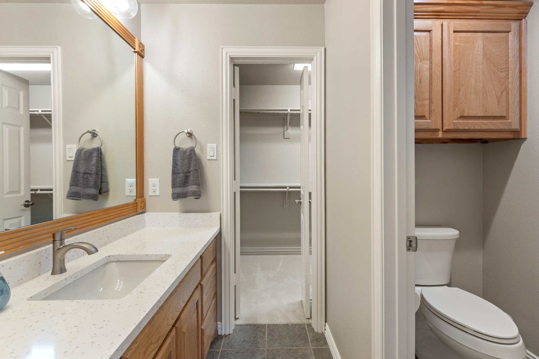 Secondary bath with oak cabinetry