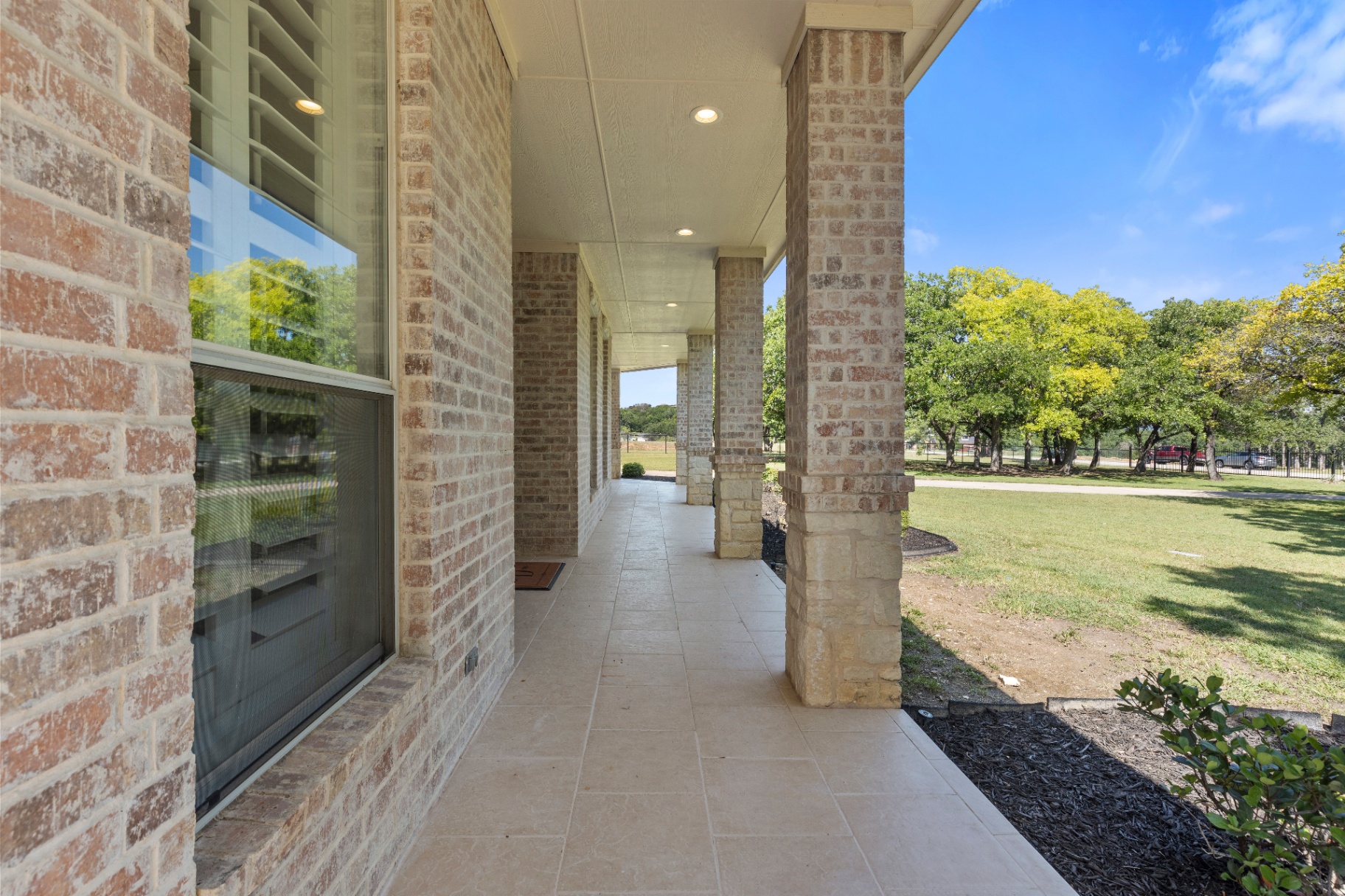 Covered front porch with brick columns