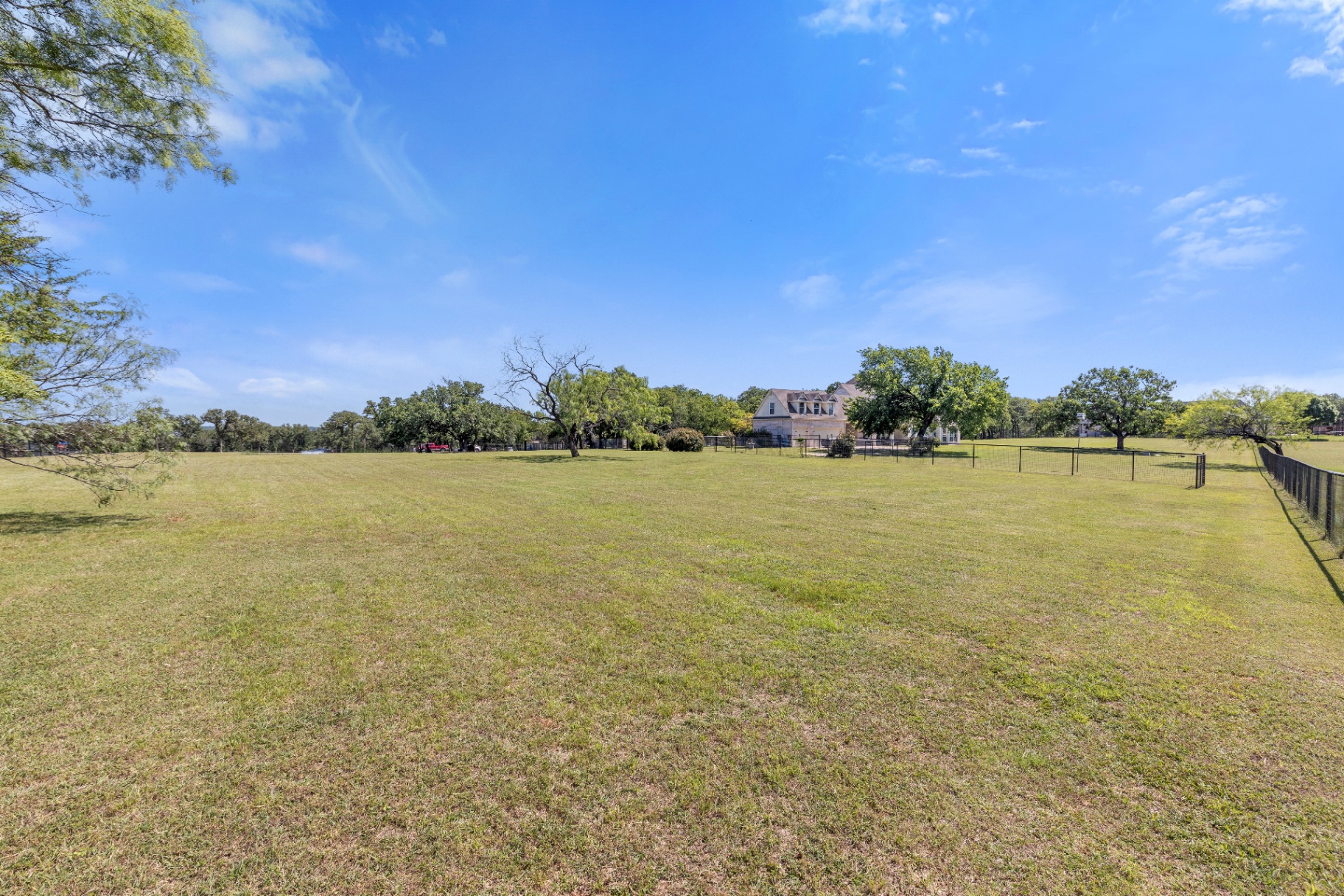 Open pasture and pipe fencing