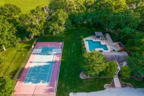 Aerial of Cattlebaron Parc II community pool, tennis court, and clubhouse